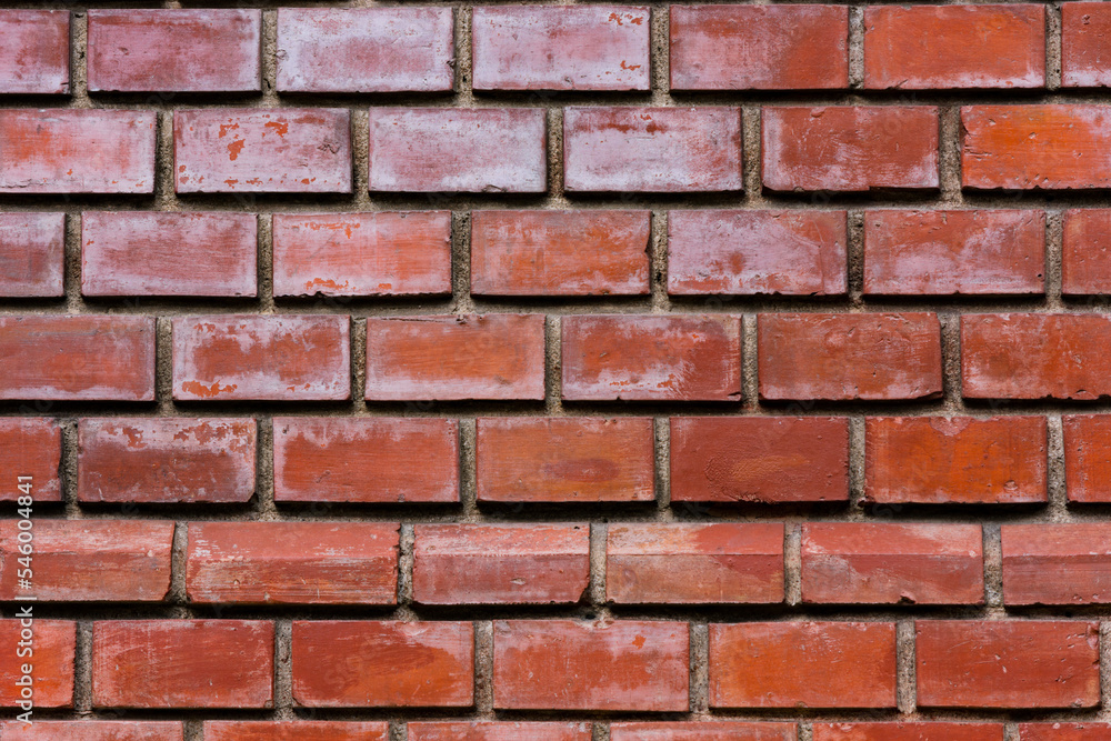 Close up to a red glossy brick wall. Exterior design Close up to a red glossy brick wall. Exterior design