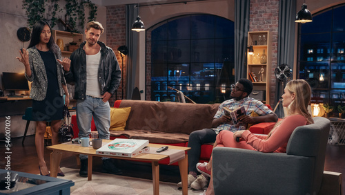 Television Sitcom about Two Couples. Four Diverse Friends Talking in Living Room, Deciding to Go Out. Clever Dialogue Comedy Sketch Series Broadcasting on Network Channel, On Demand Streaming Service. © Gorodenkoff