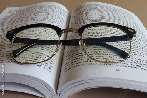 open book with glasses