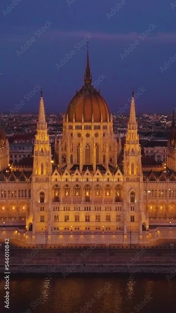 Vertical view of modern buildings at dark night in Budapest, Hungary Vertical view of modern buildings at dark night in Budapest, Hungary