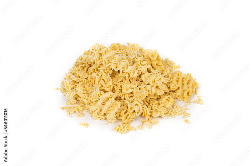 crumbled briquette of dry instant noodles on a white background