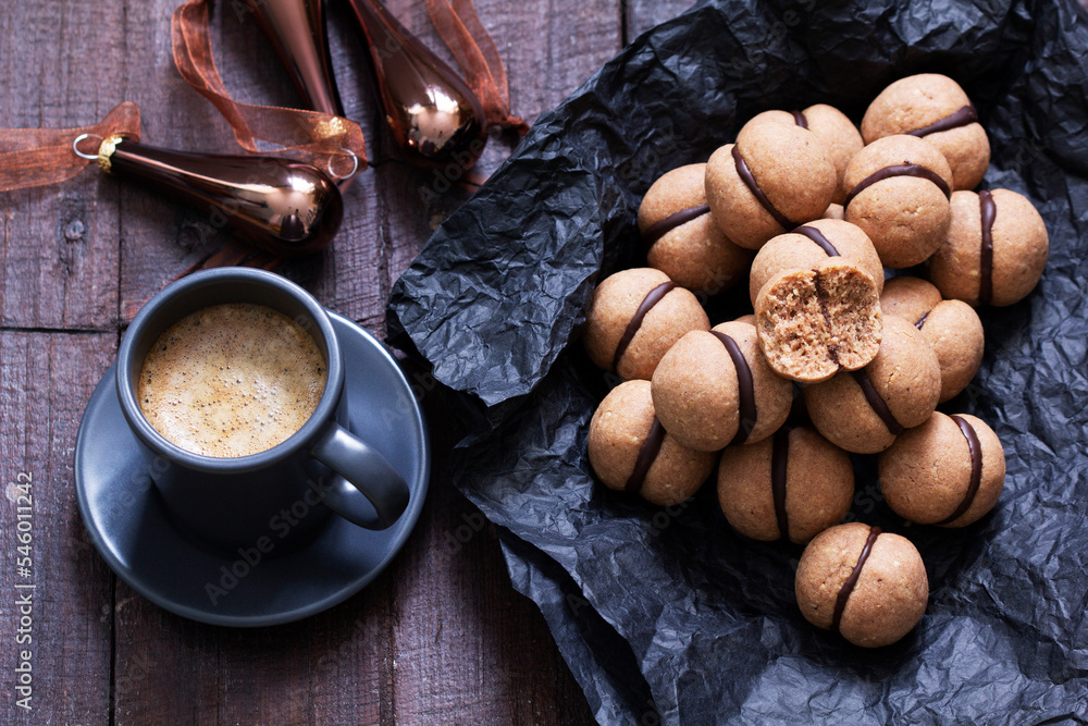 Lady's kisses, traditional Italian nut cookies with coffee and chocolate filling.