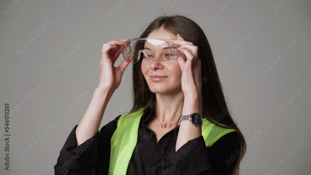Construction worker. Woman engineer on white background in studio Construction worker. Woman engineer on white background in studio
