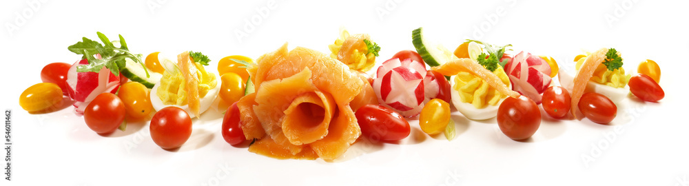 Smoked Salmon Rose with Cherry Tomatoes and Deviled Eggs and Vegetables. Low Carb Panorama isolated on white Background. Smoked Salmon Rose with Cherry Tomatoes and Deviled Eggs and Vegetables. Low Carb Panorama isolated on white Background.