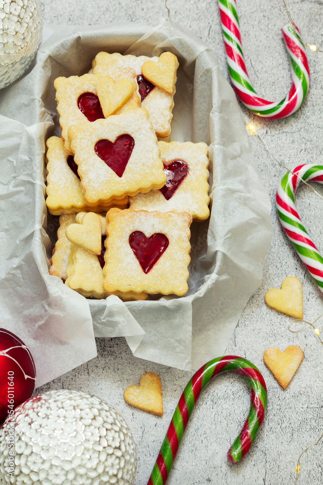 Sugar cookies stuffed with raspberry jam on a light background. Christmas and New Year's decor.