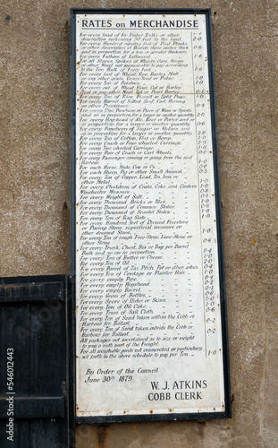 old sign of rates on merchandise dated june 30 1879 on the Cobb at Lyme Regis Dorset England