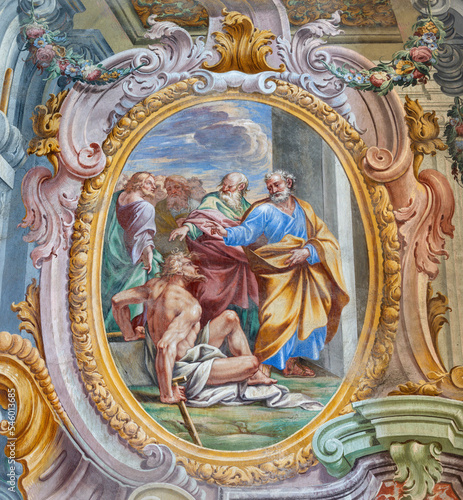 VARALLO, ITALY - JULY 17, 2022: The fresco Saints Peter and John Healing the Lame Man in the church Basilica del Sacro Monte by Francesco Leva (1714).