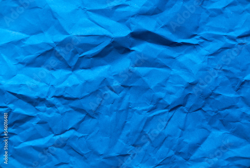 Blue crumpled paper for background.