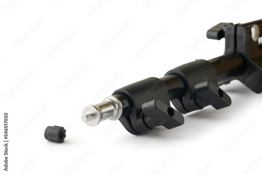 close-up of studio light stand with screw head, black color adjustable tripod isolated on white background, taken in selective focus, photography and videography concept close-up of studio light stand with screw head, black color adjustable tripod isolated on white background, taken in selective focus, photography and videography concept