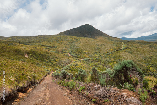A dirt road against a mountain background at Chogoria Route, Mount Kenya photo