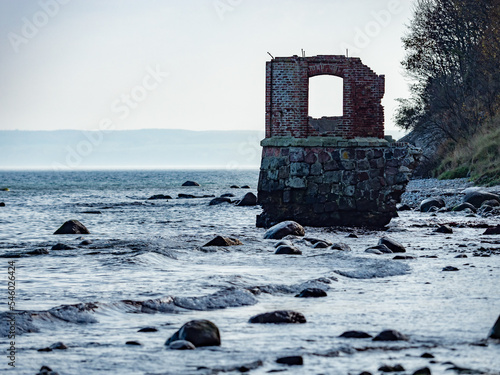 Ruins of the old gauge tower on shore bellow Cape Arkona cliff