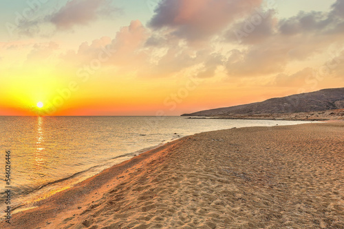Fototapeta Naklejka Na Ścianę i Meble -  The sunrise from the beach Psathi in Ios island, Greece