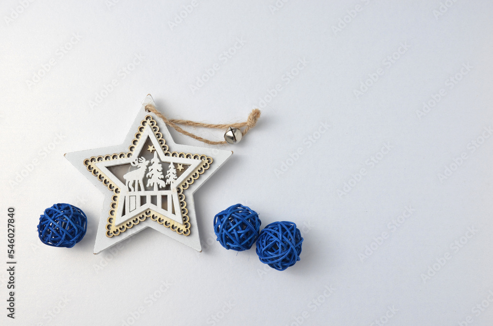 White Christmas star, blue balls. Grey background. White Christmas star, blue balls. Grey background.