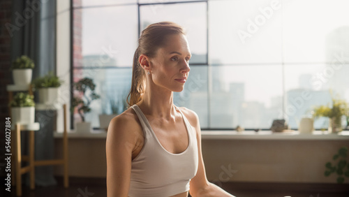Young Beautiful Female Exercising, Practising Meditation in the Morning in Her Bright Sunny Loft Apartment. Healthcare, Fitness, Wellbeing and Mindfulness Concept. Side View Close Up. Free Download Young Beautiful Female Exercising, Practising Meditation in the Morning in Her Bright Sunny Loft Apartment. Healthcare, Fitness, Wellbeing and Mindfulness Concept. Side View Close Up. - GFXLoad