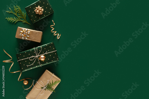 Christmas gift on a green background. Copy space. 