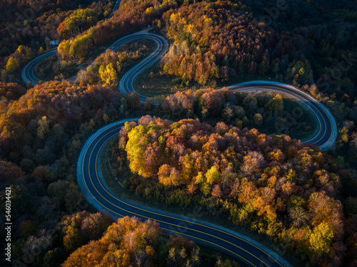 View of winding road among autumn colors.