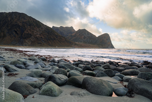 Dramatic waves during sunset at iconic unstad beach on lofoten islands norway