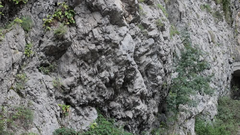 An old abandoned highway in the mountains. Rock and tree collapses, rockfalls on the road. Rocks, mountain gorge. An old abandoned highway in the mountains. Rock and tree collapses, rockfalls on the road. Rocks, mountain gorge.