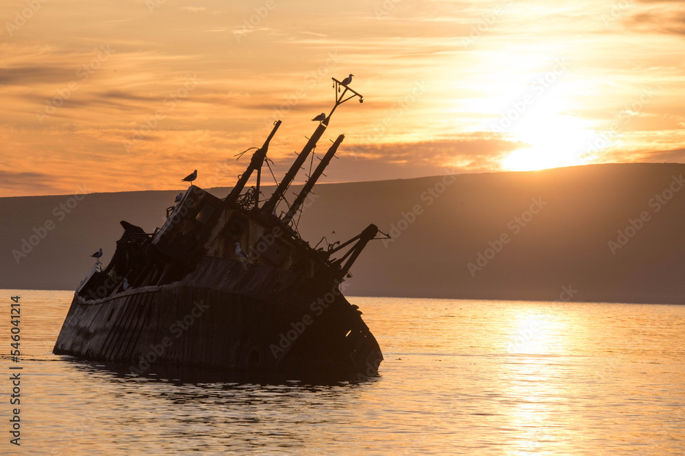 Abandoned ships on the beach of Severo-Kurilsk. Russia