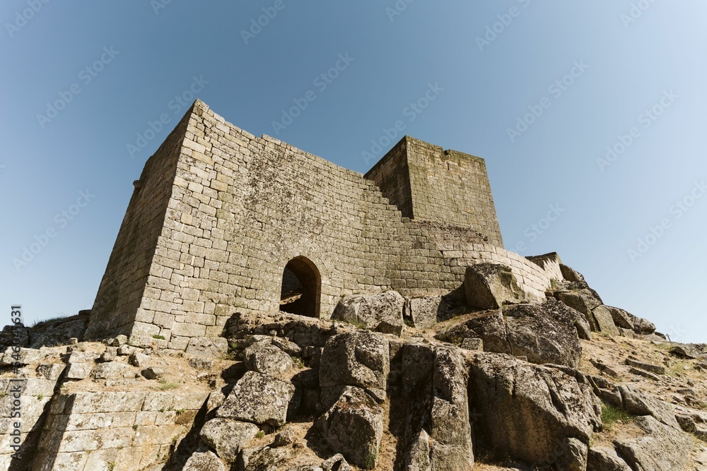 Low-angle shot of a building made of bricks in the Castle of Marialva, Portugal Low-angle shot of a building made of bricks in the Castle of Marialva, Portugal