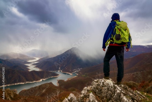 Hiker standing on a mountain peak in Kozjak National reserve, Macedonia