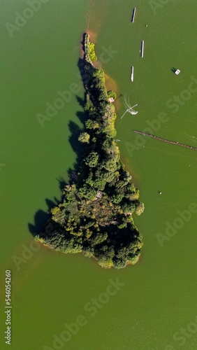 Aerial view of a small green island from a drone. Donkvijver, Oudenaarde, Belgium. photo