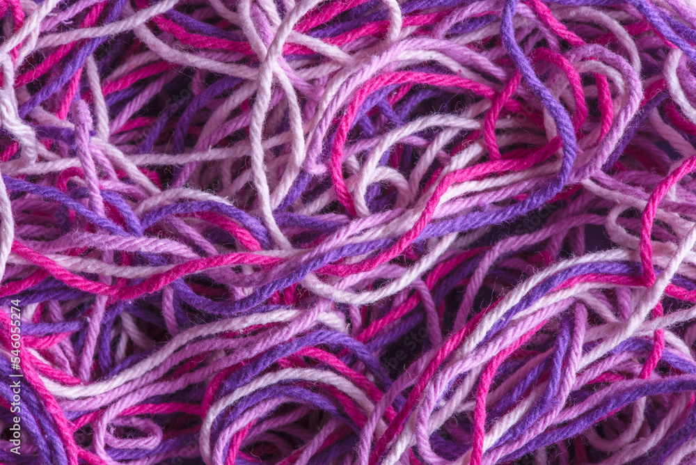 Close-up colorful wool for knitting and weaving, multi colored tangled yarn