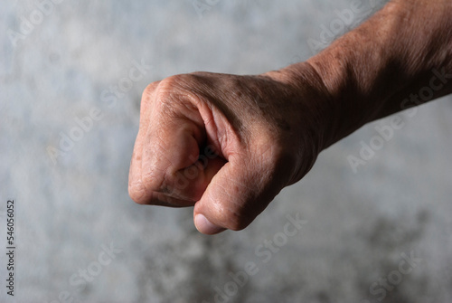 Older man's hands, anatomical detail, skin texture, expression and manual language, working man's hand.