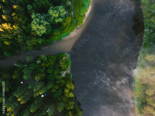 Top view of a river in the middle of a forest