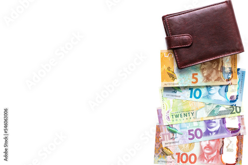 New Zealand dollars and wallet on a white background, all denominations of banknotes, copy space, business and financial concept photo