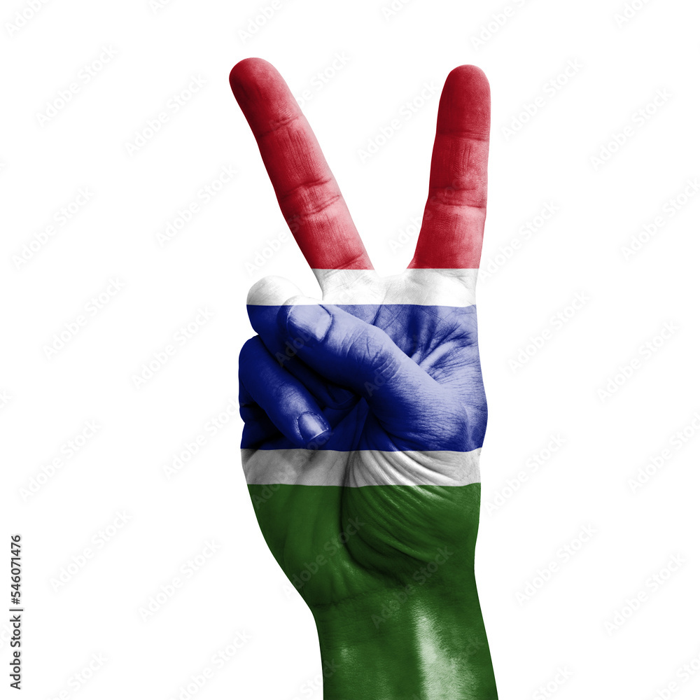 Hand making the V victory sign with flag of gambia