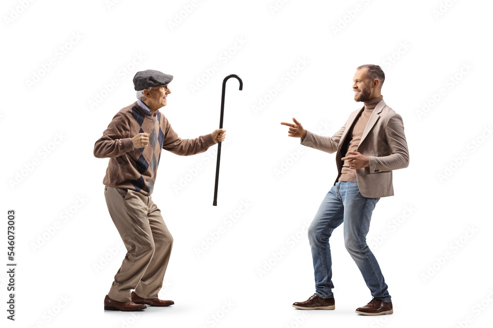 Full length profile shot of an elderly and younger man Full length profile shot of an elderly and younger man