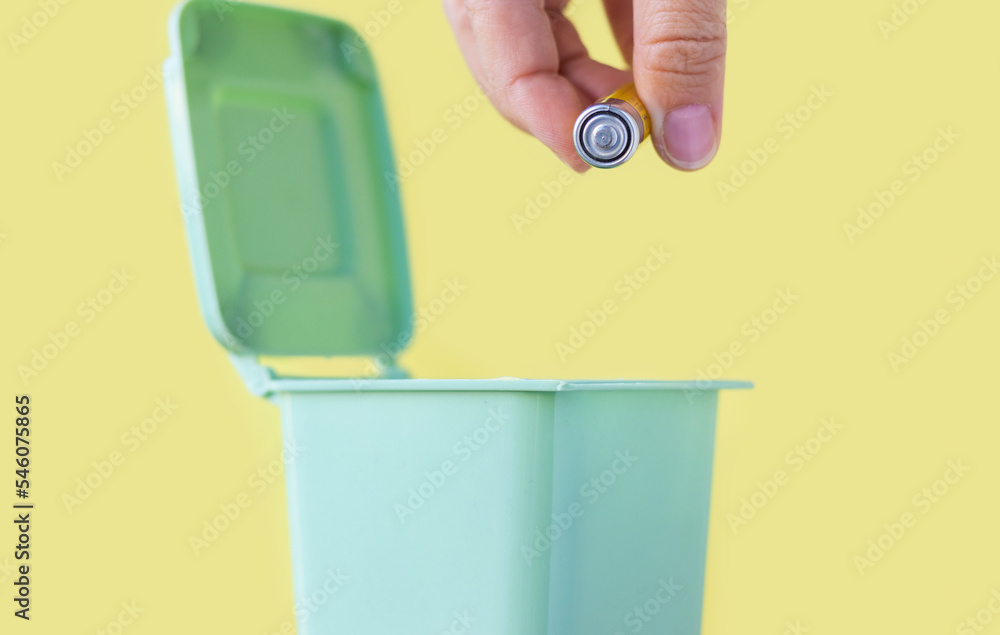 woman hand throwing in trash mini small garbage bin can broken smartphone white paper napkin