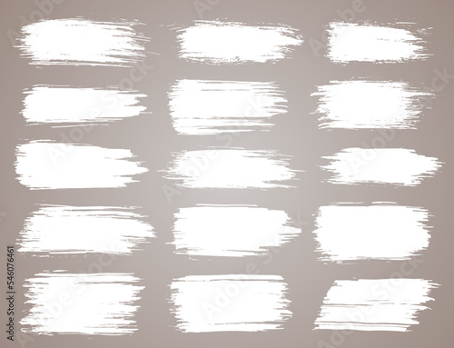 Paint brush. White ink grunge brush strokes. Vector paintbrush set. Grunge design elements. Painted ink stripes. Creative isolated spots. Ink smudge abstract shape stains and smear set