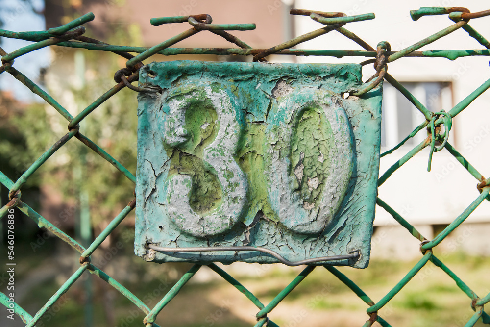 Old retro weathered cast iron plate number 30 closeup Old retro weathered cast iron plate number 30 closeup