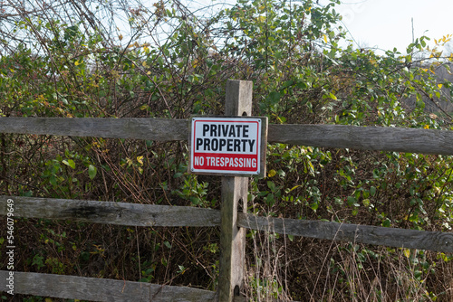 This is a typical sign you see as a hiker or a hunter. It is a private property sign indicating where you can be and where not to be. The bold red, white, and black colors really helps to standout.