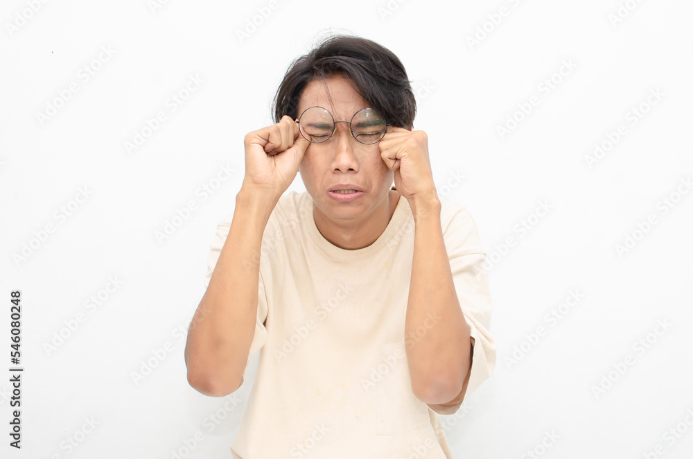 asian man looks depressed and messed up. Irritated man bites lips and scratches head. stressed over work concept. asian man looks depressed and messed up. Irritated man bites lips and scratches head. stressed over work concept.