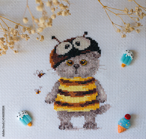 Cross-stitch cat in a bee costume