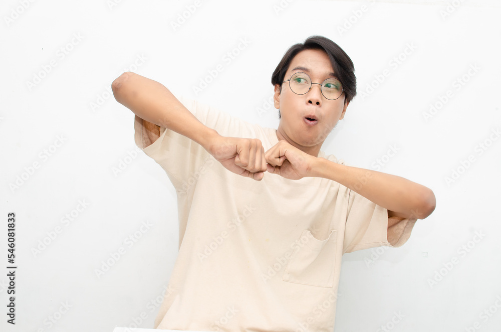 asian man dancing hapily with yes hand gesture celebrating good news isolated over white background. People, joy, fun and happiness concept. celebrating party concept asian man dancing hapily with yes hand gesture celebrating good news isolated over white background. People, joy, fun and happiness concept. celebrating party concept