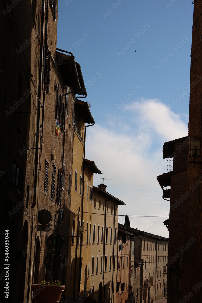 Old narrow alley in San Gimignano, Tuscany Italy