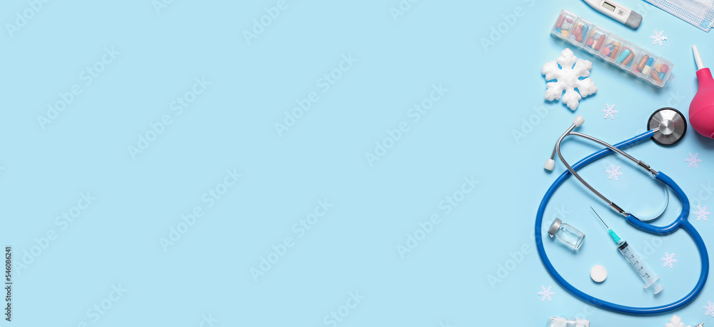 Supplies of doctor with Christmas decorations on light blue background with space for text Supplies of doctor with Christmas decorations on light blue background with space for text