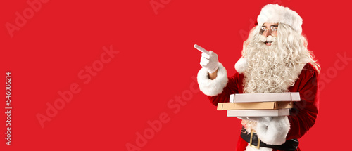 Santa Claus holding boxes w...