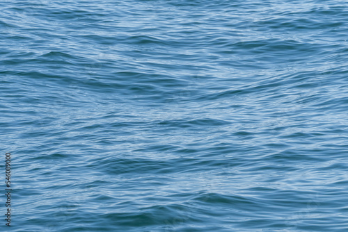 A background image of water waves