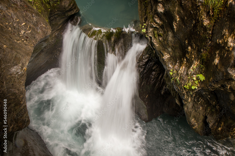 Fototapeta premium The beautiful view of Sigmund Thun Gorge - Sigmund Thun Klamm. Cascade valley of wild Kapruner Ache near Kaprun, Austria. Crystal clear blue water. 4K background, HD wallpaper.