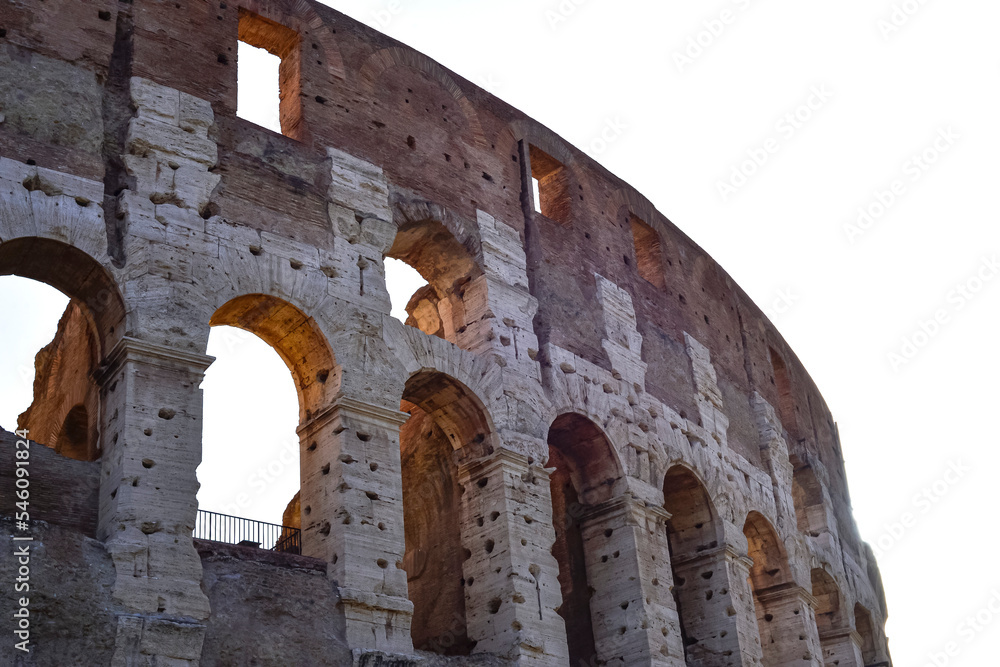 Obraz premium Colosseum at sunset in Rome, Italy. The Colosseum in city of Rome at sunset in Italy, ancient Flavian Amphitheatre and Gladiators stadium.