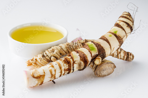 fresh yarrow root on a white acrylic background photo