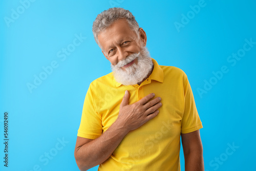Senior bearded man in yello...