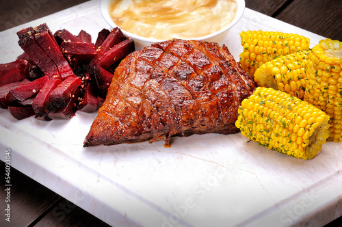 Grilled Beef or Picanha on the white marble board. Top view.