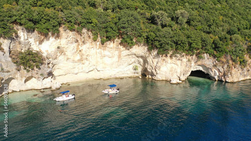 Aerial drone photo of famous small bay and beach with crystal clear sea and caves of Desimi near Nidri in island of Lefkada, Ionian, Greece photo