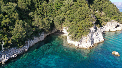 Fototapeta Naklejka Na Ścianę i Meble -  Aerial drone photo of famous small bay and beach with crystal clear sea and caves of Desimi near Nidri in island of Lefkada, Ionian, Greece